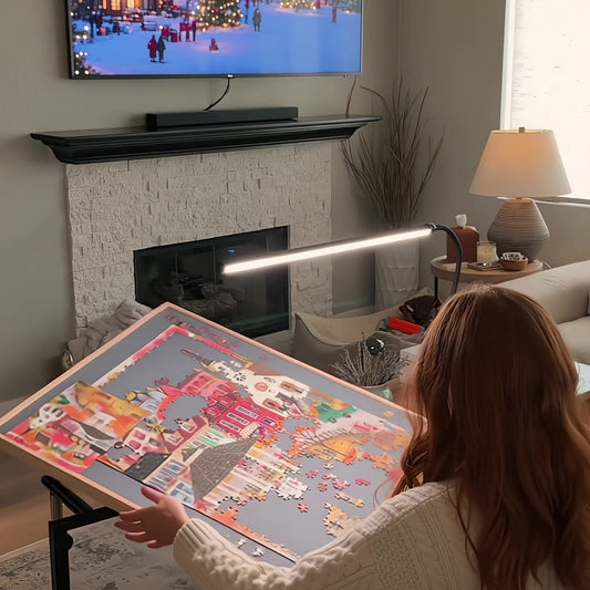 Pieceful puzzle table tilted toward her with the LED light on